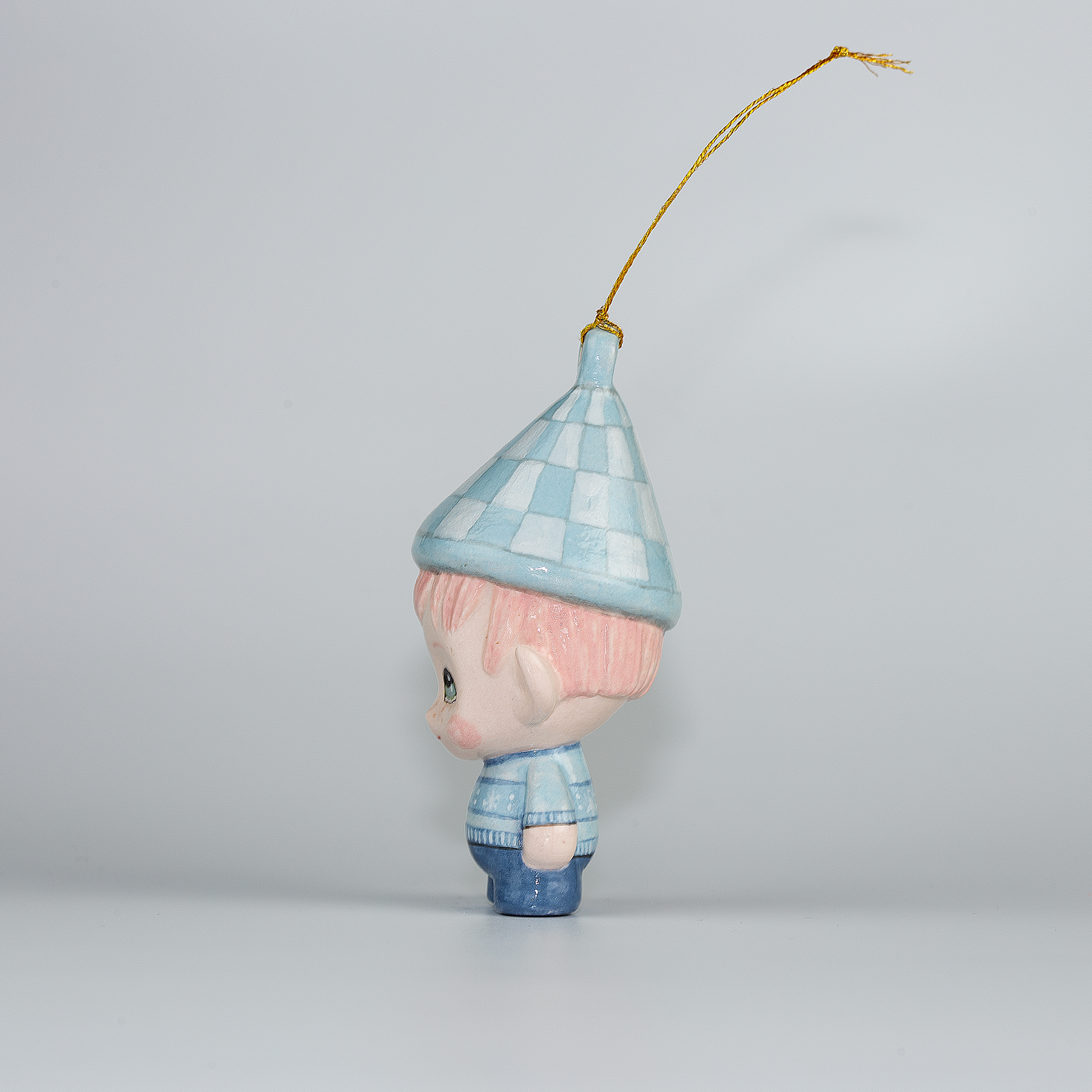 Handmade Porcelain Christmas ornament. One-of-a-kind. Sally, the Christmas Sweater designer Elf.