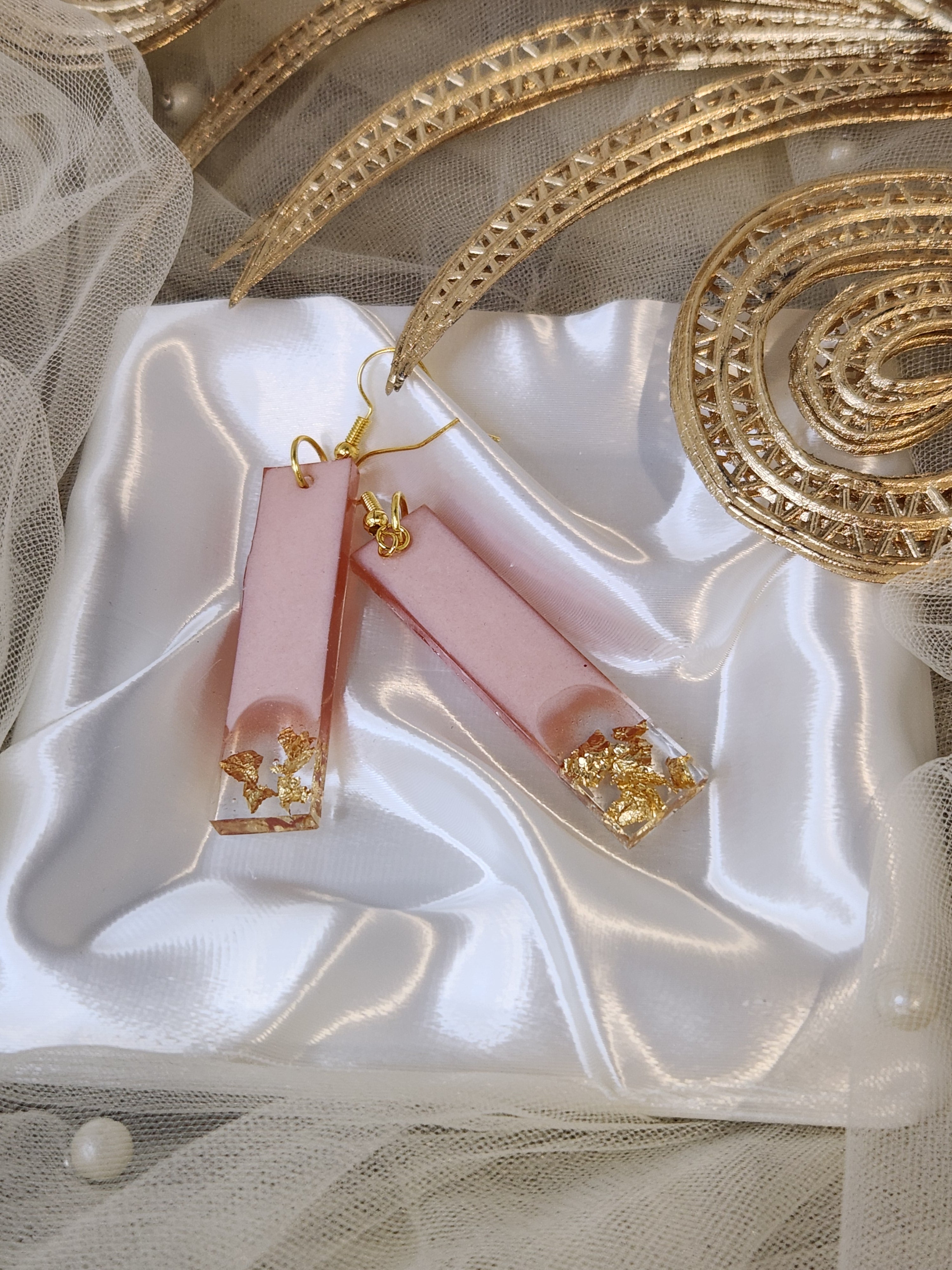 Drop earrings with metallic accents
