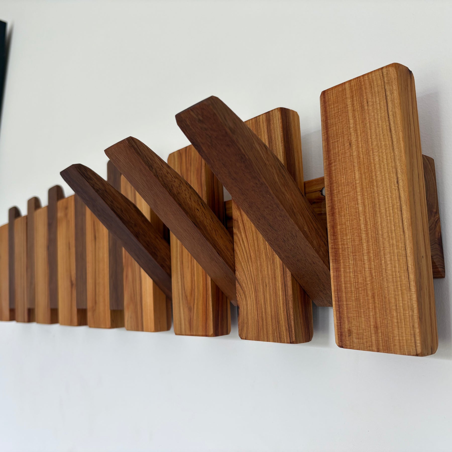 Two tone piano style coatrack