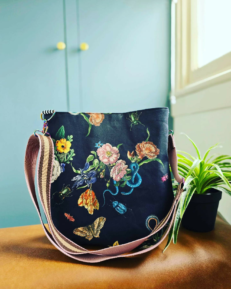 Large black crossbody bag. Snakes, bugs and flowers.