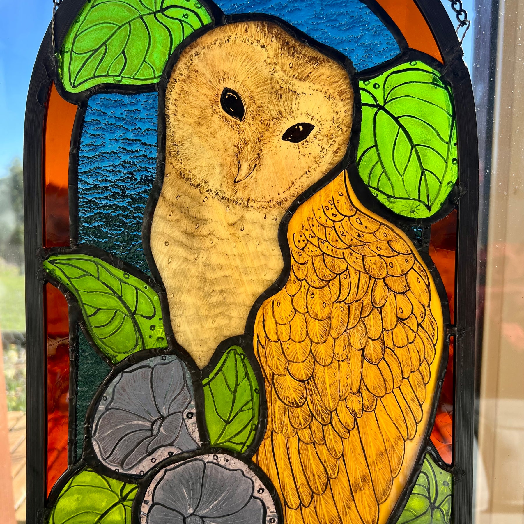 Stained glass owl panel.