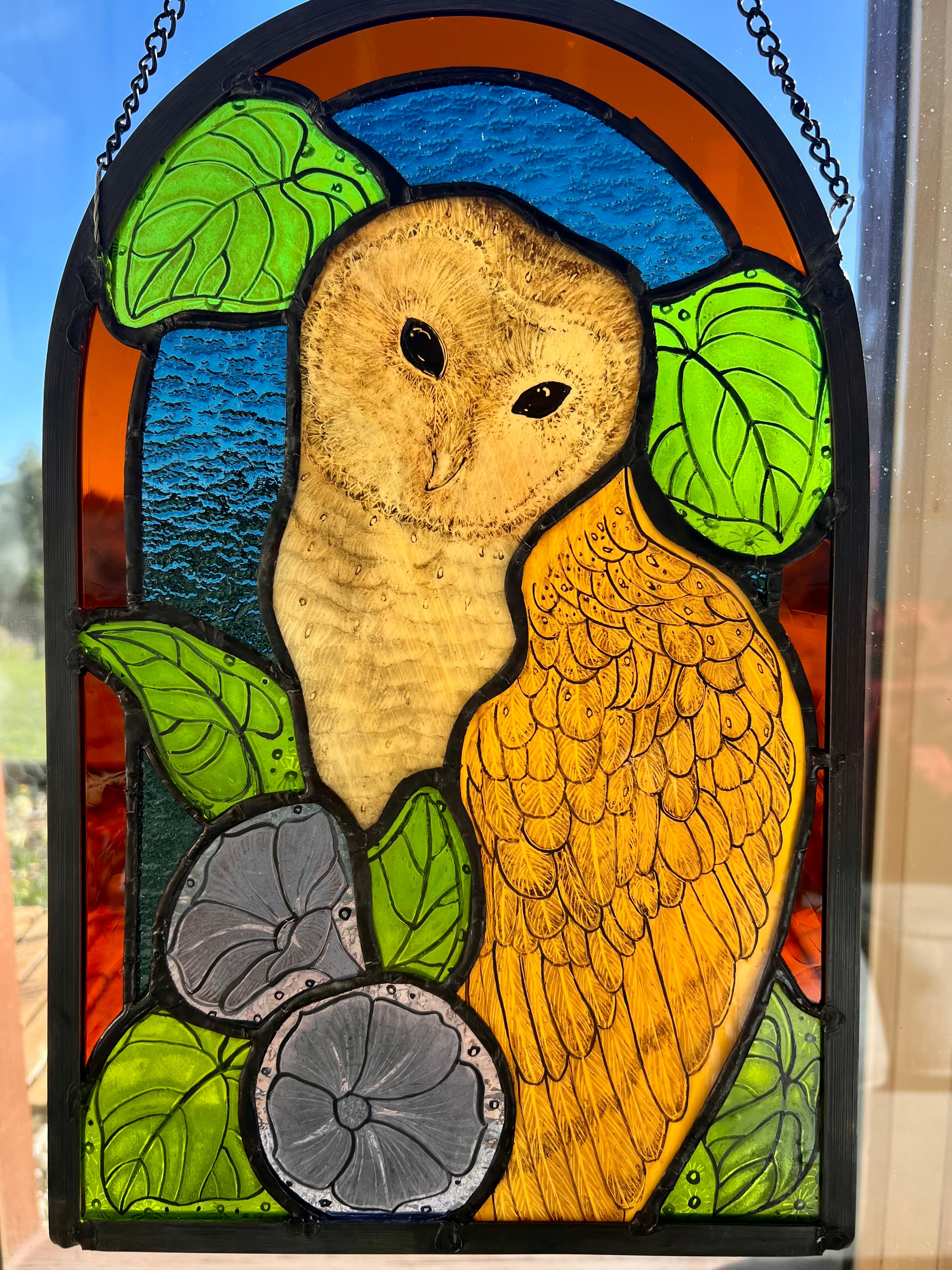 Stained glass owl panel.