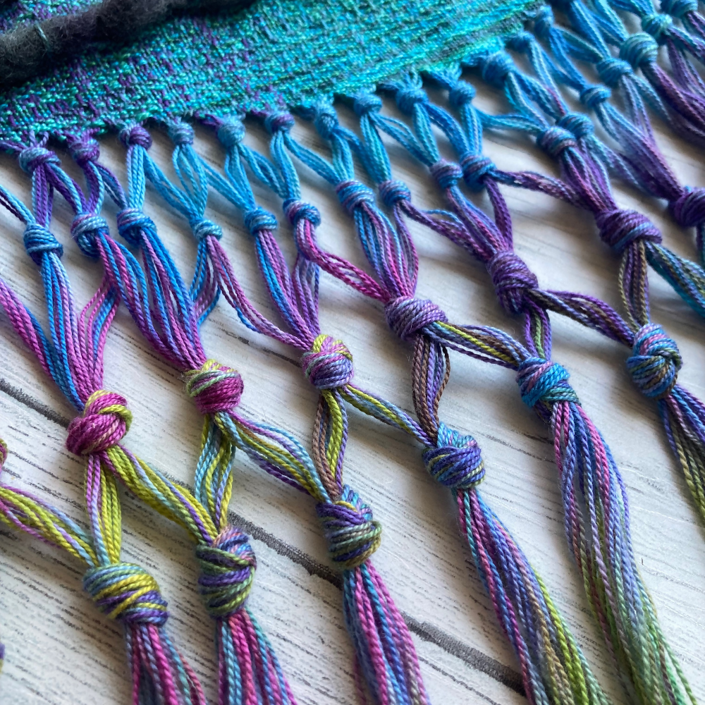 handwoven-wall-hanging-rainbow-entangled-happiness-handwovens-closeup-fringe-pink-multicolour