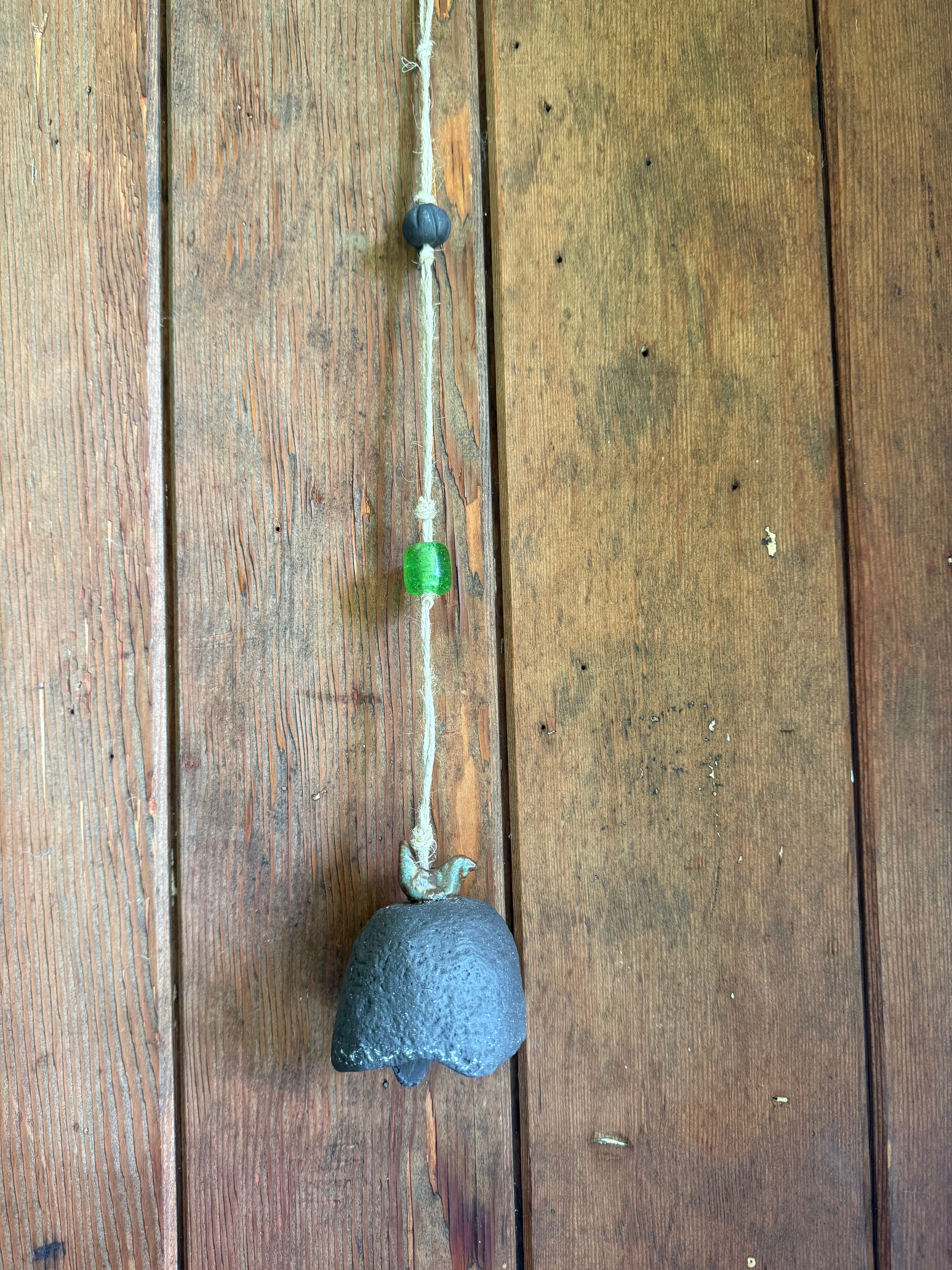 Rustic bell with bird