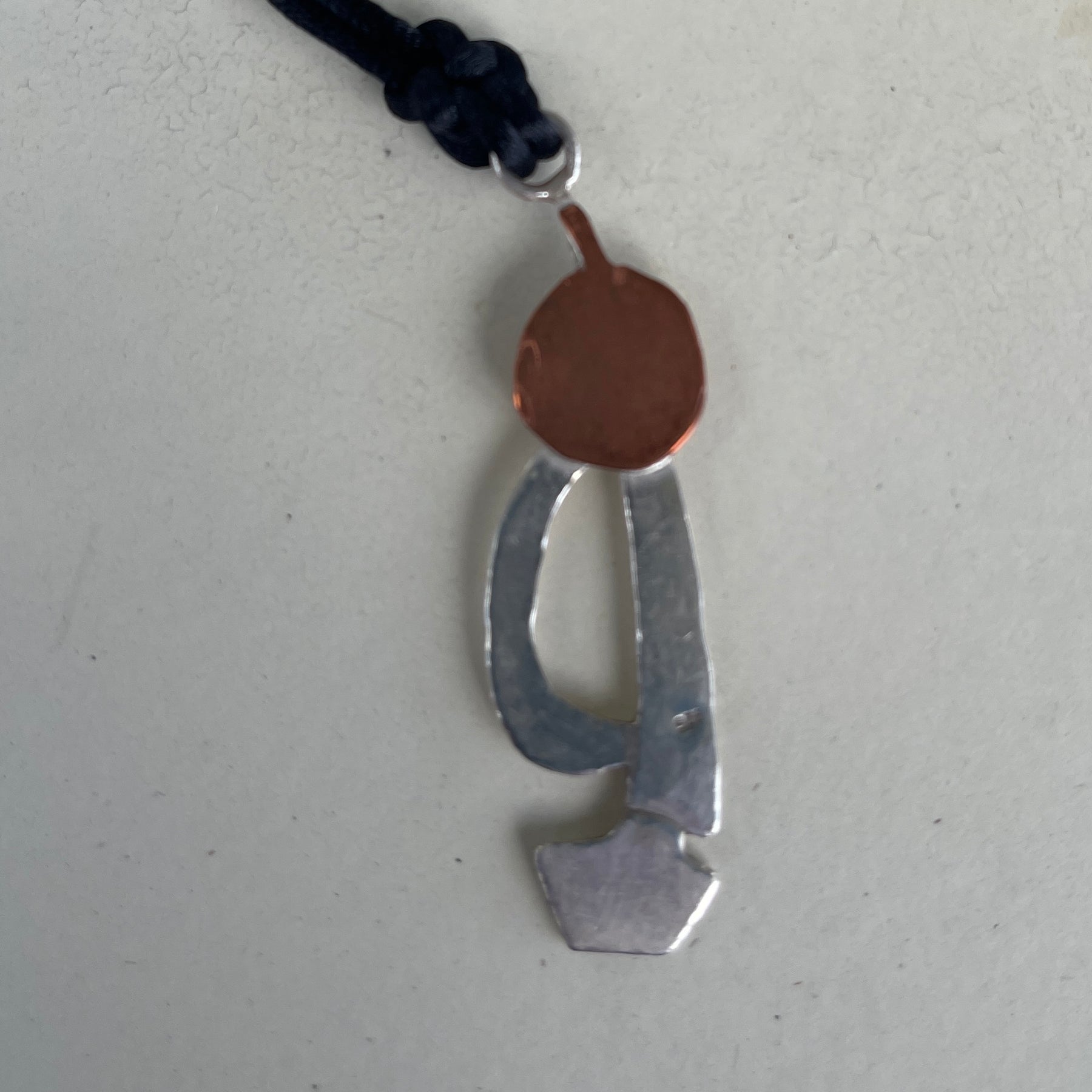 Silver and copper sailing boat into the blood moon