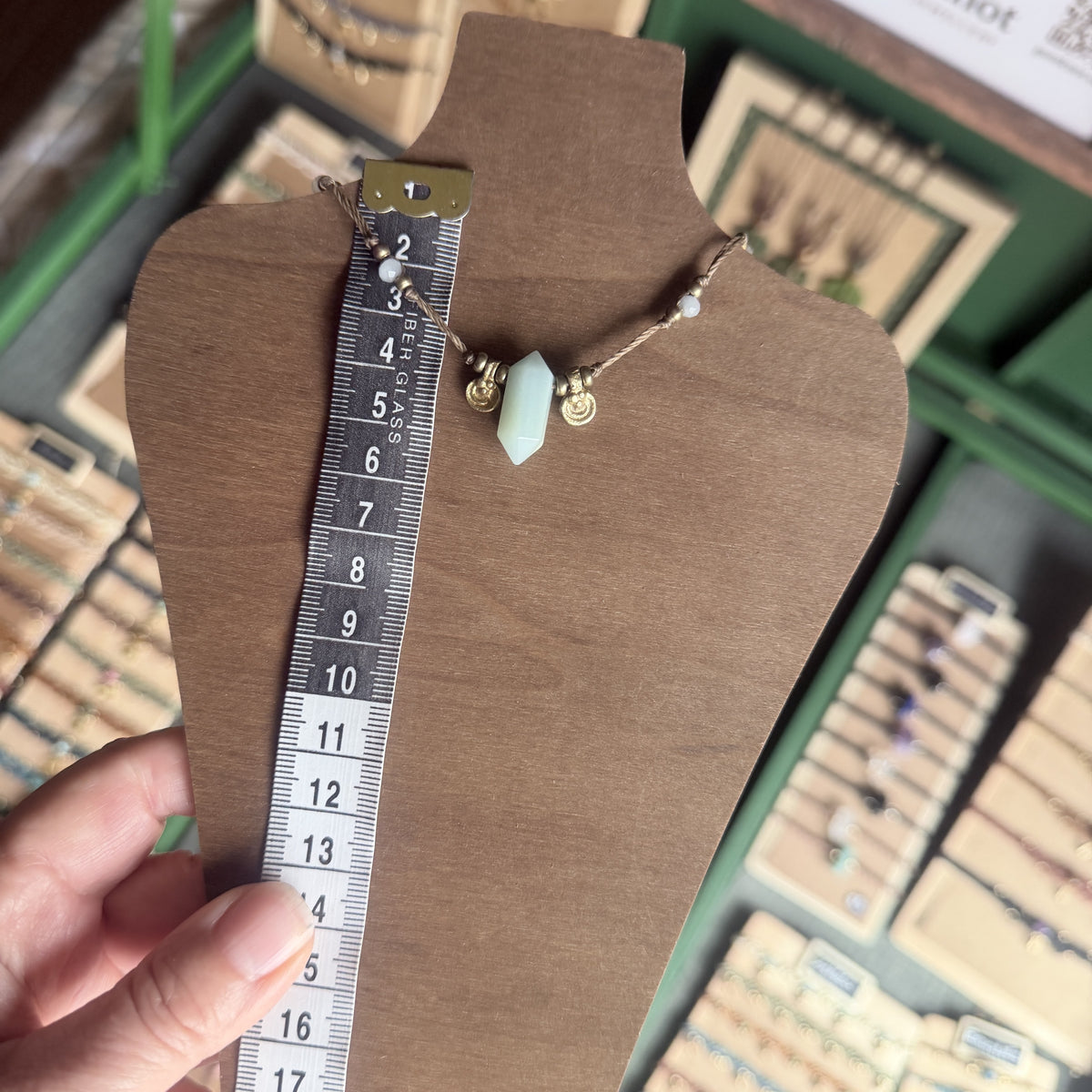 Crystal point necklace with faceted beads and solid brass charm