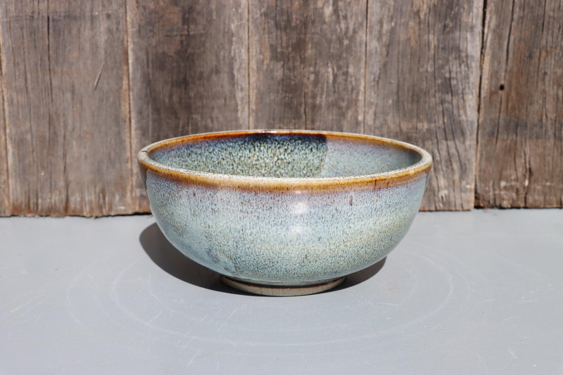 Stoneware bowls hand made with white speckled chun glaze over teadust brown.
