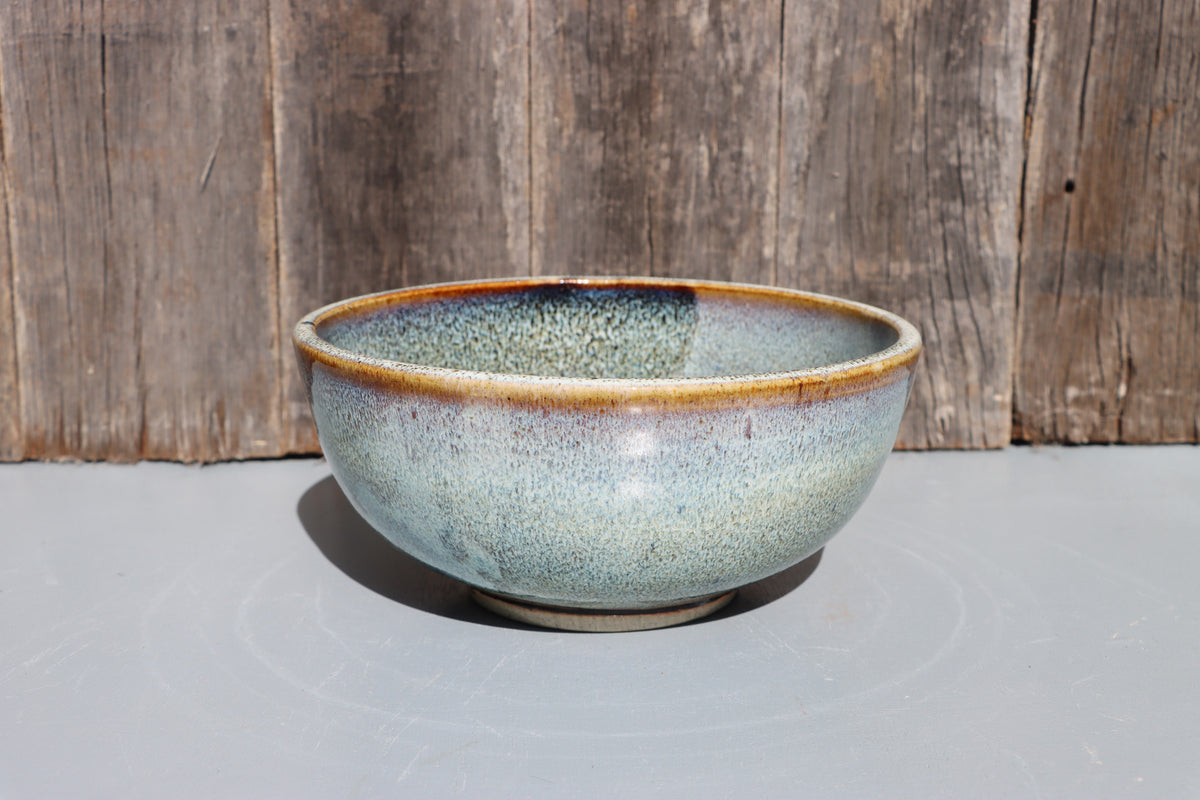 Stoneware bowls hand made with white speckled chun glaze over teadust brown.