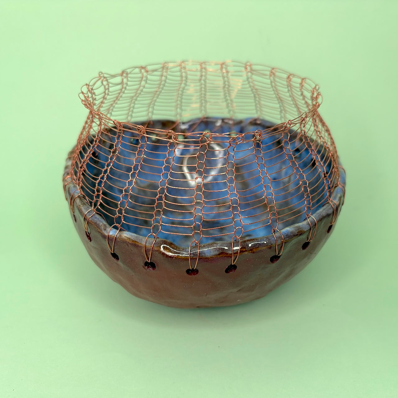 Ceramic bowl with knitted wire