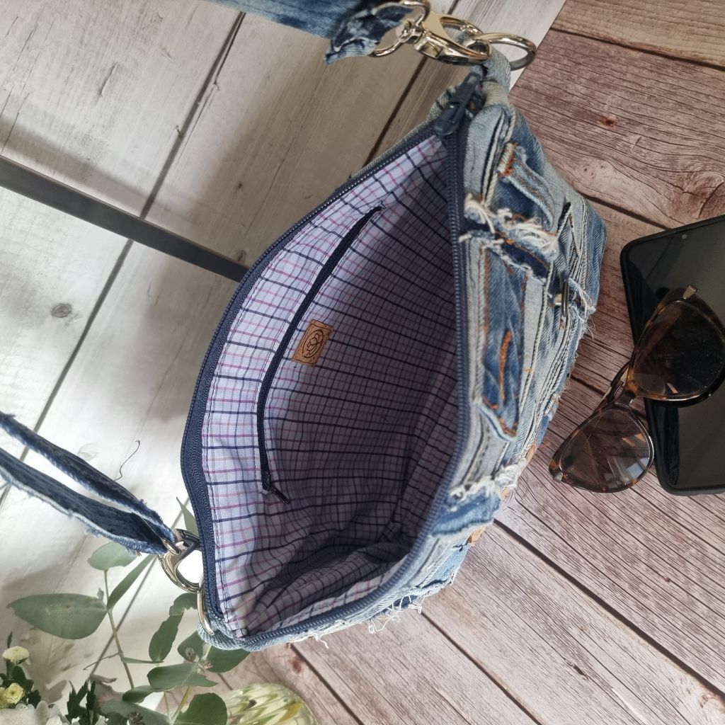 Handmade upcycled angle patched denim zip crossbody bag