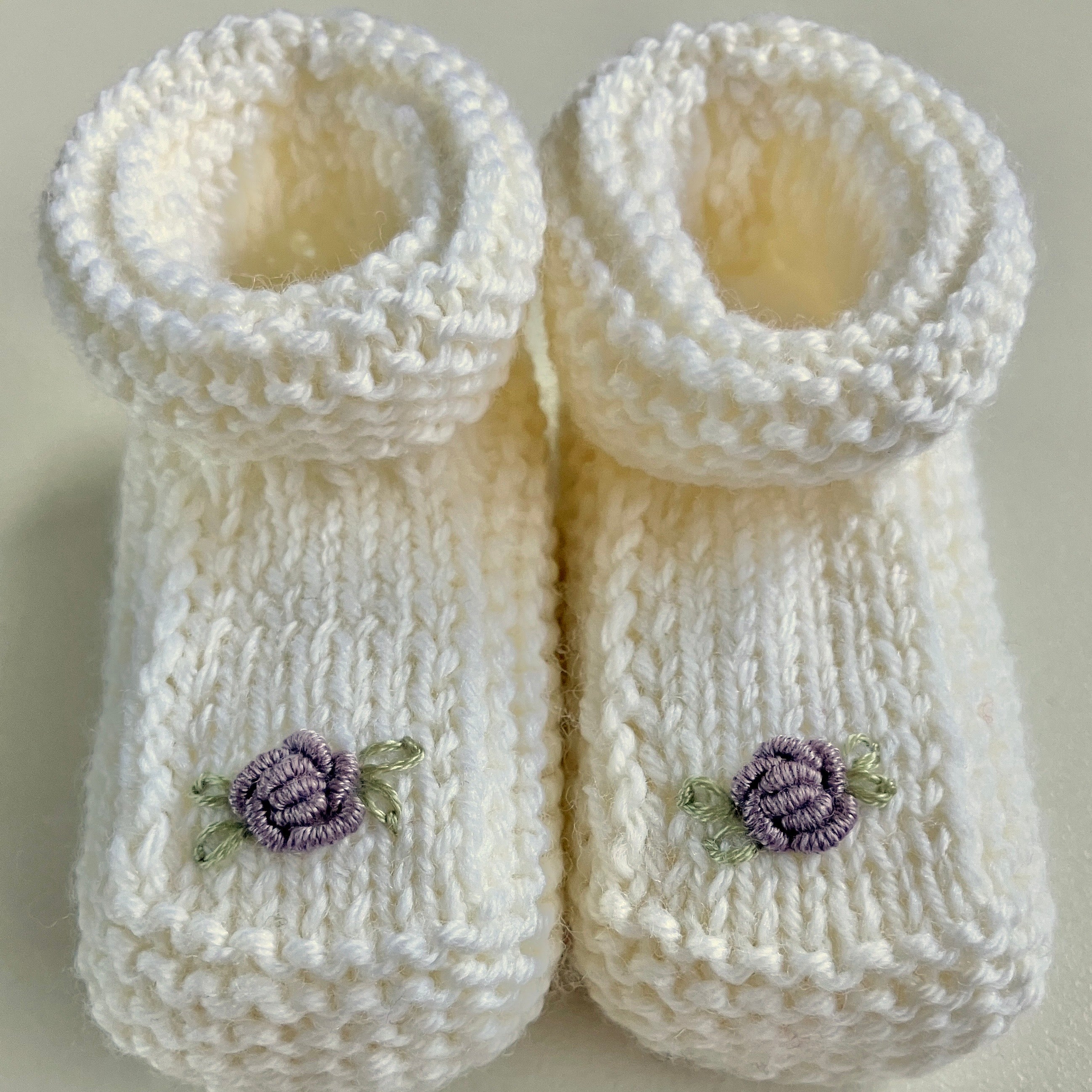 Hand-knitted baby booties with hand-embroidered rosebuds (Australian merino wool)