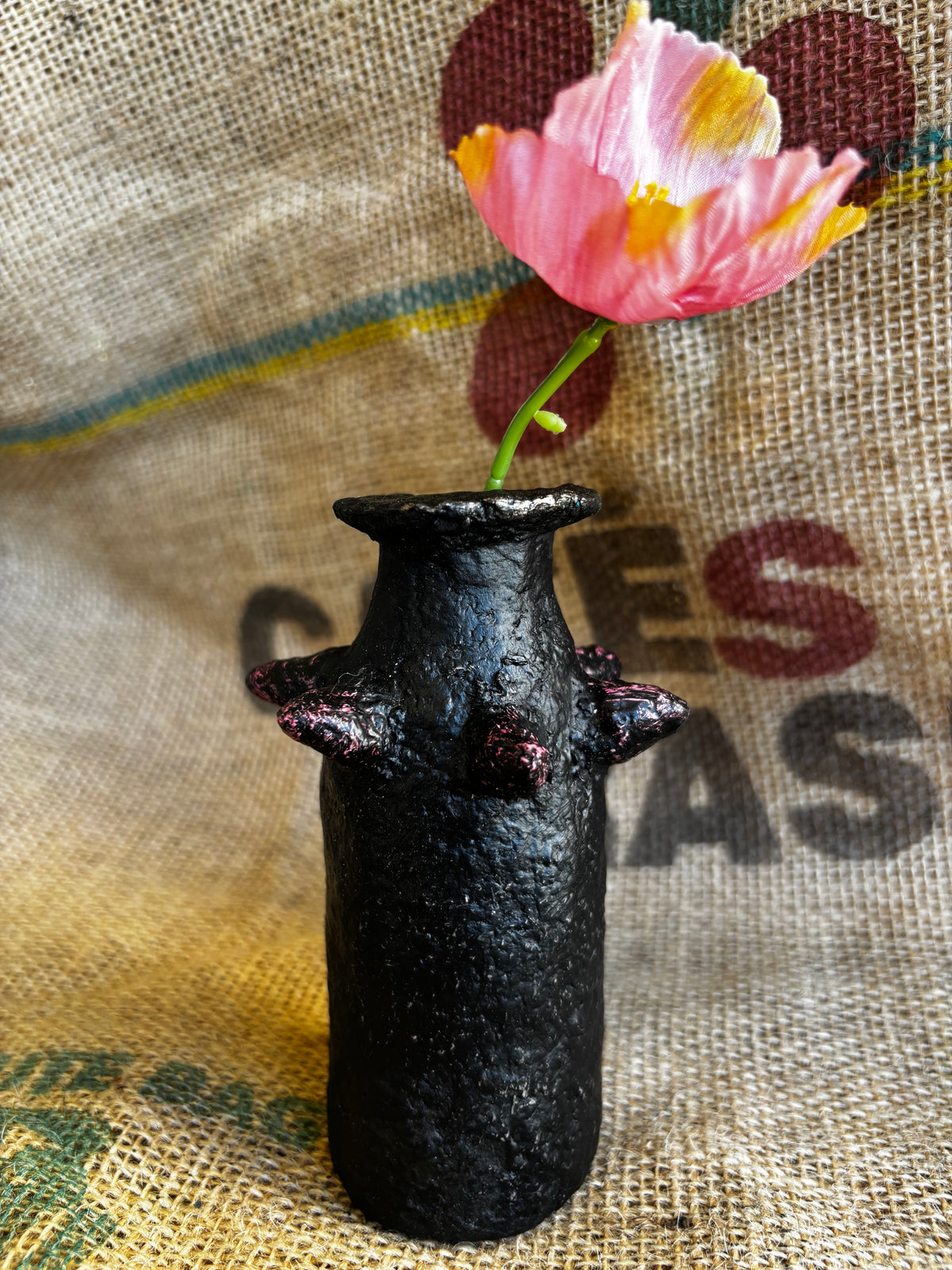 Small vase with pinkish studs