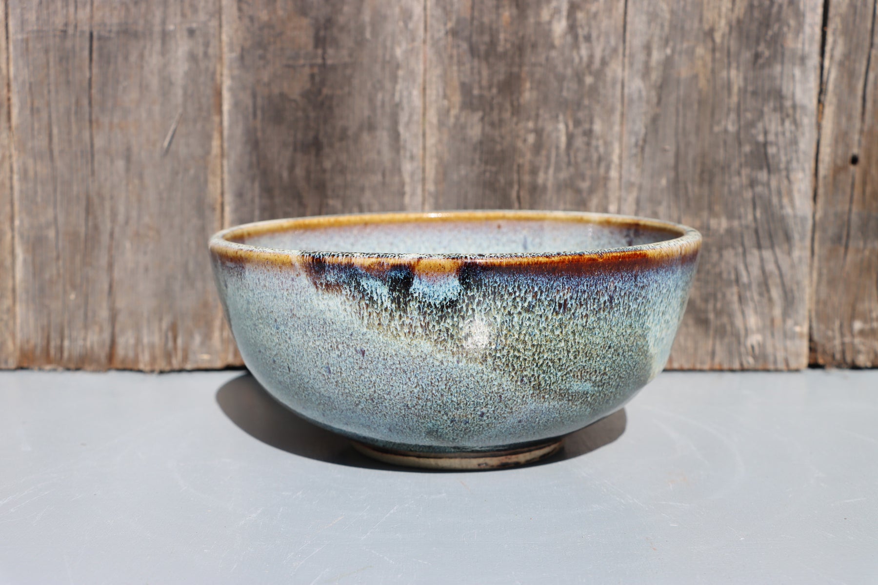 Stoneware bowls hand made with white speckled chun glaze over teadust brown.
