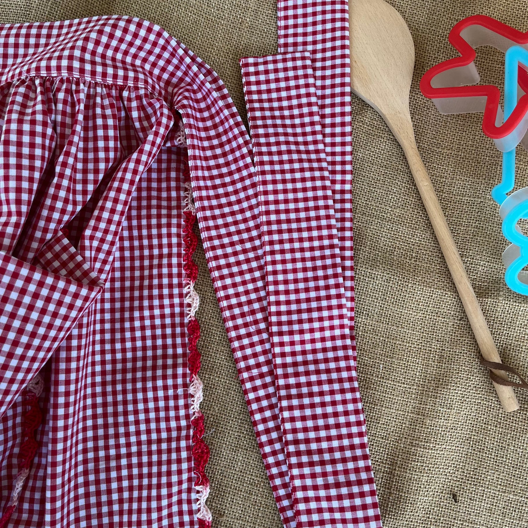 Red gingham apron with hand crochet lady