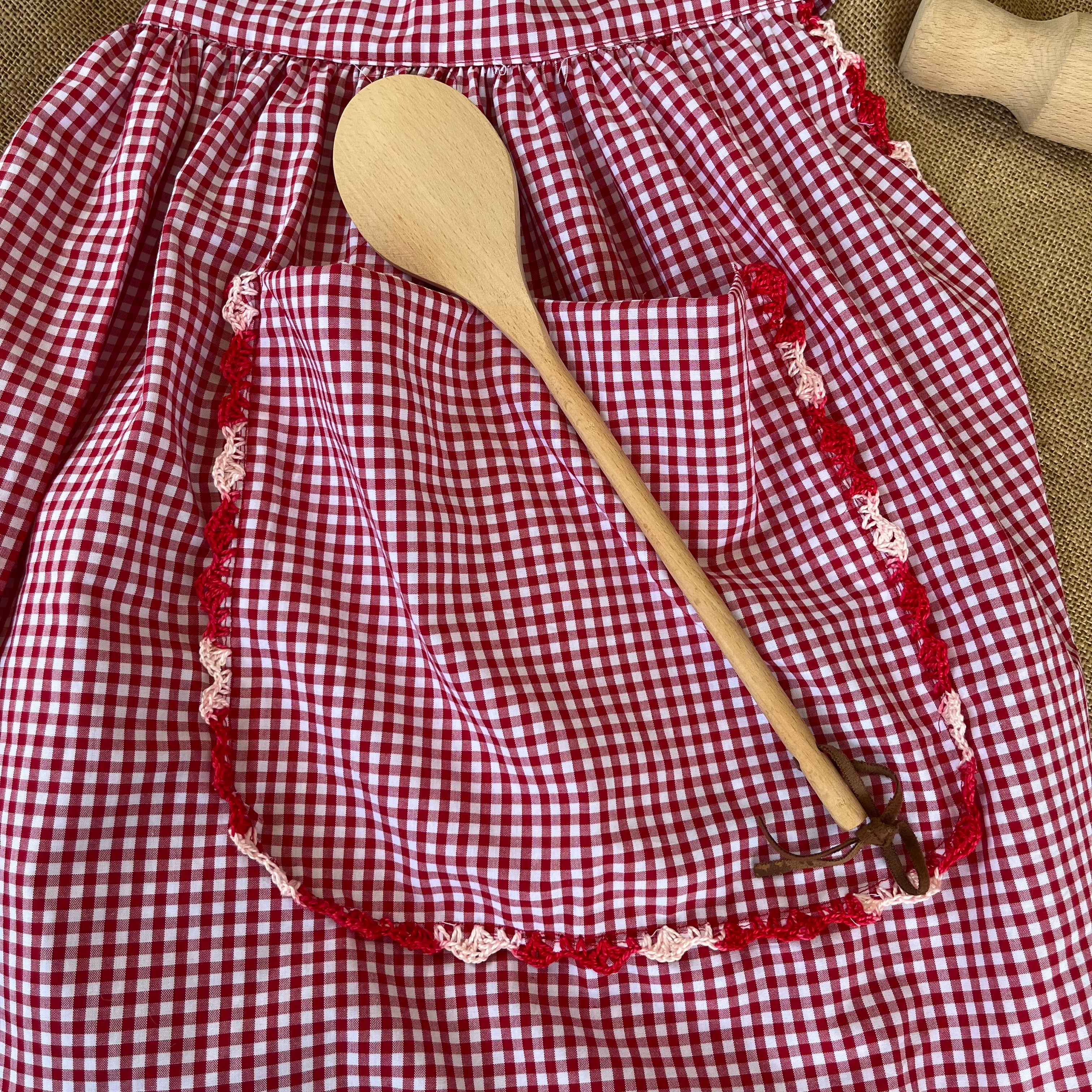 Red gingham apron with hand crochet lady