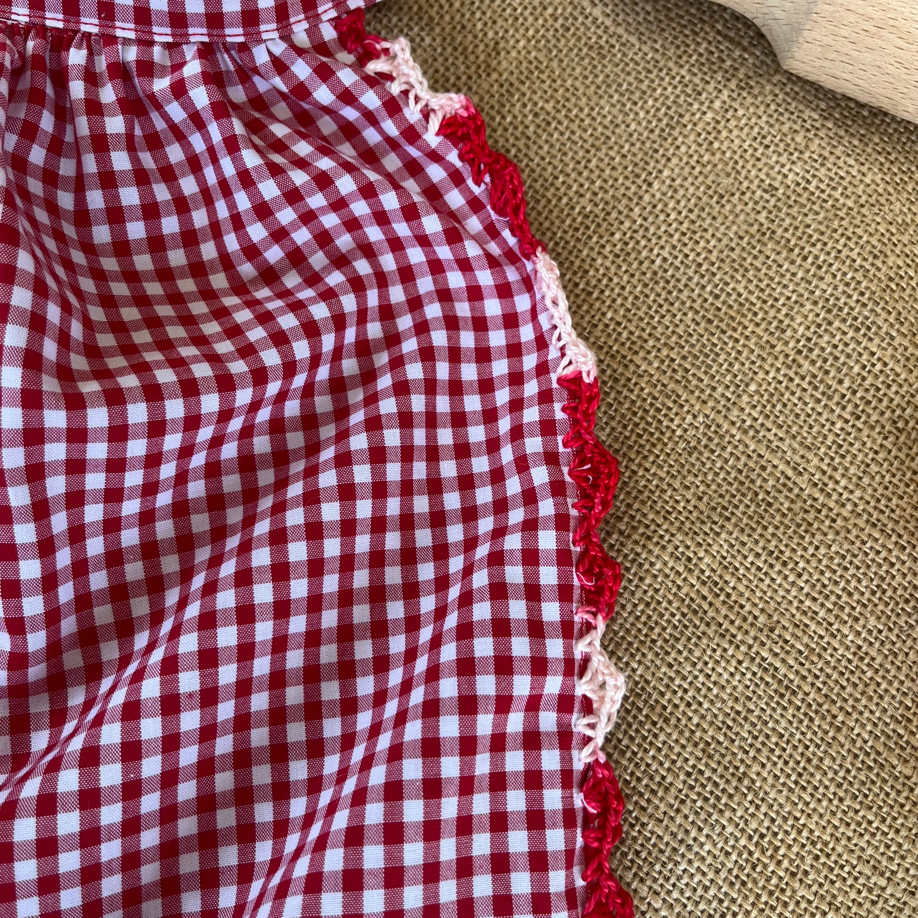 Red gingham apron with hand crochet lady