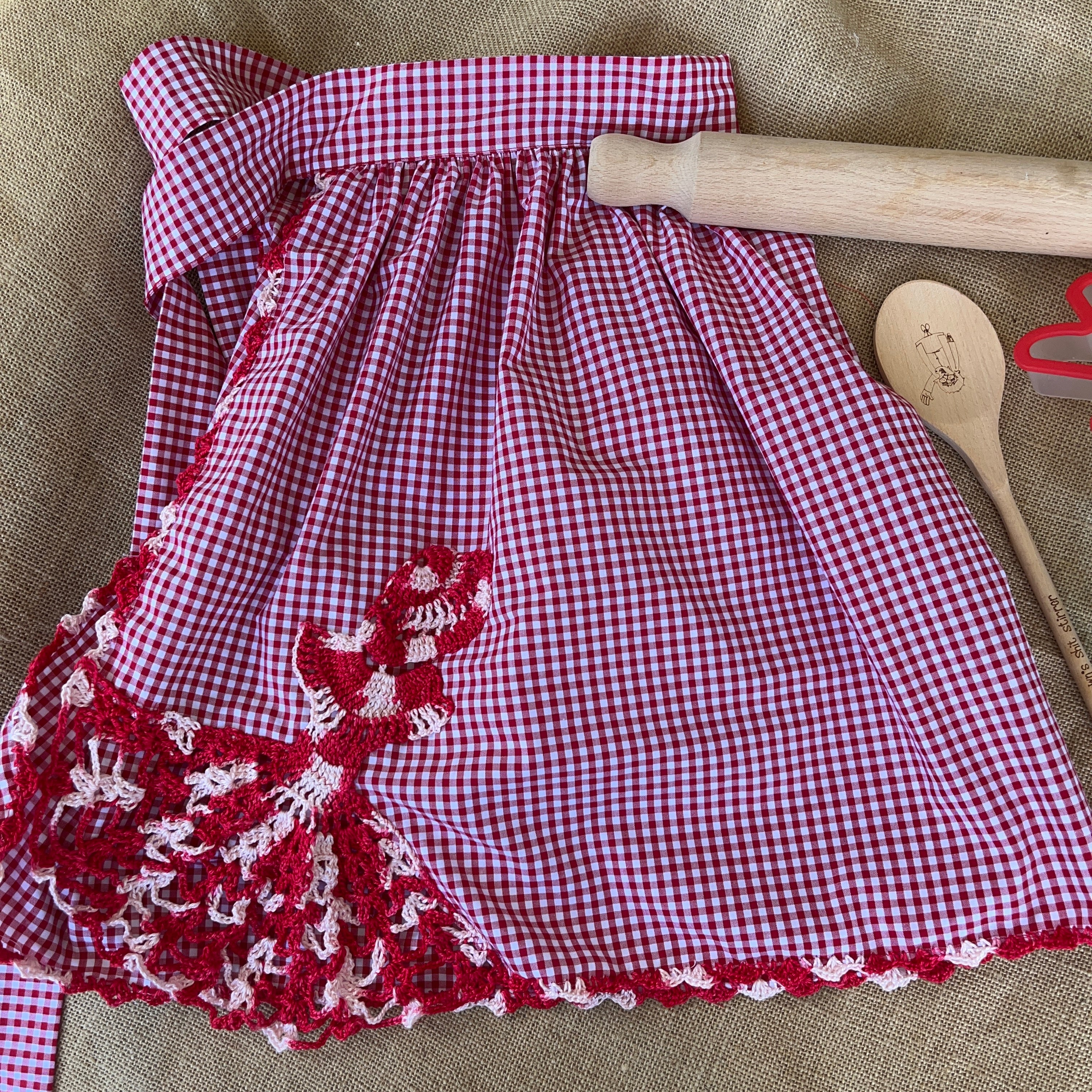 Red gingham apron with hand crochet lady