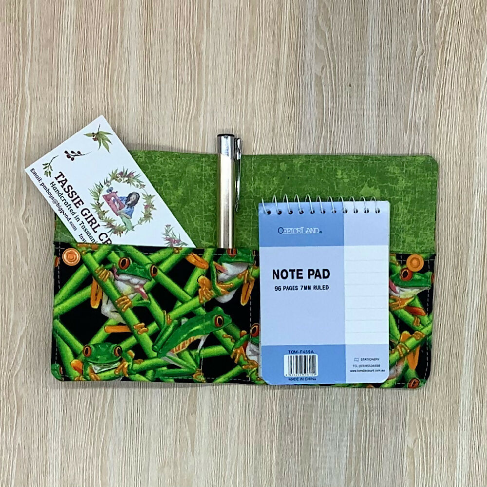 Green Frogs refillable fabric pocket notepad cover with snap closure. Incl. book and pen.
