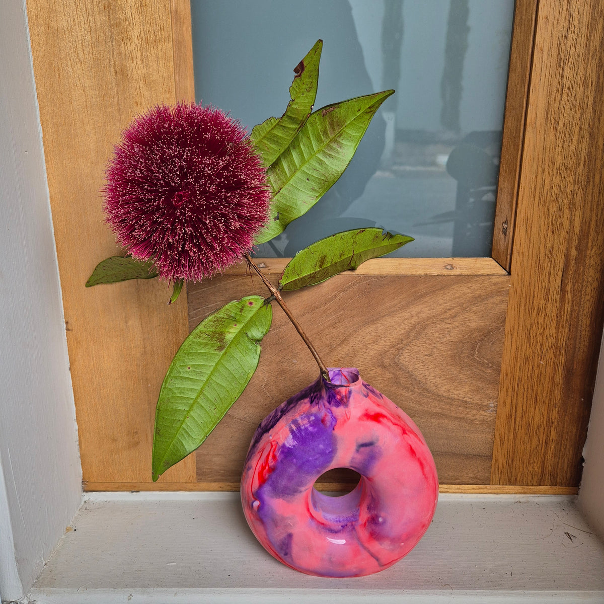 Red and purple concrete donut vase