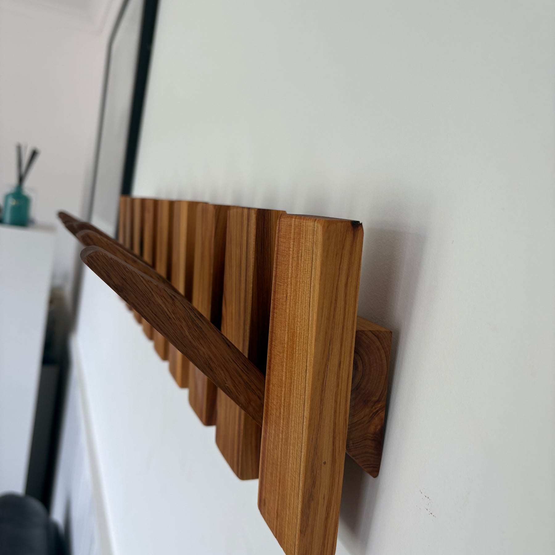 Two tone piano style coatrack