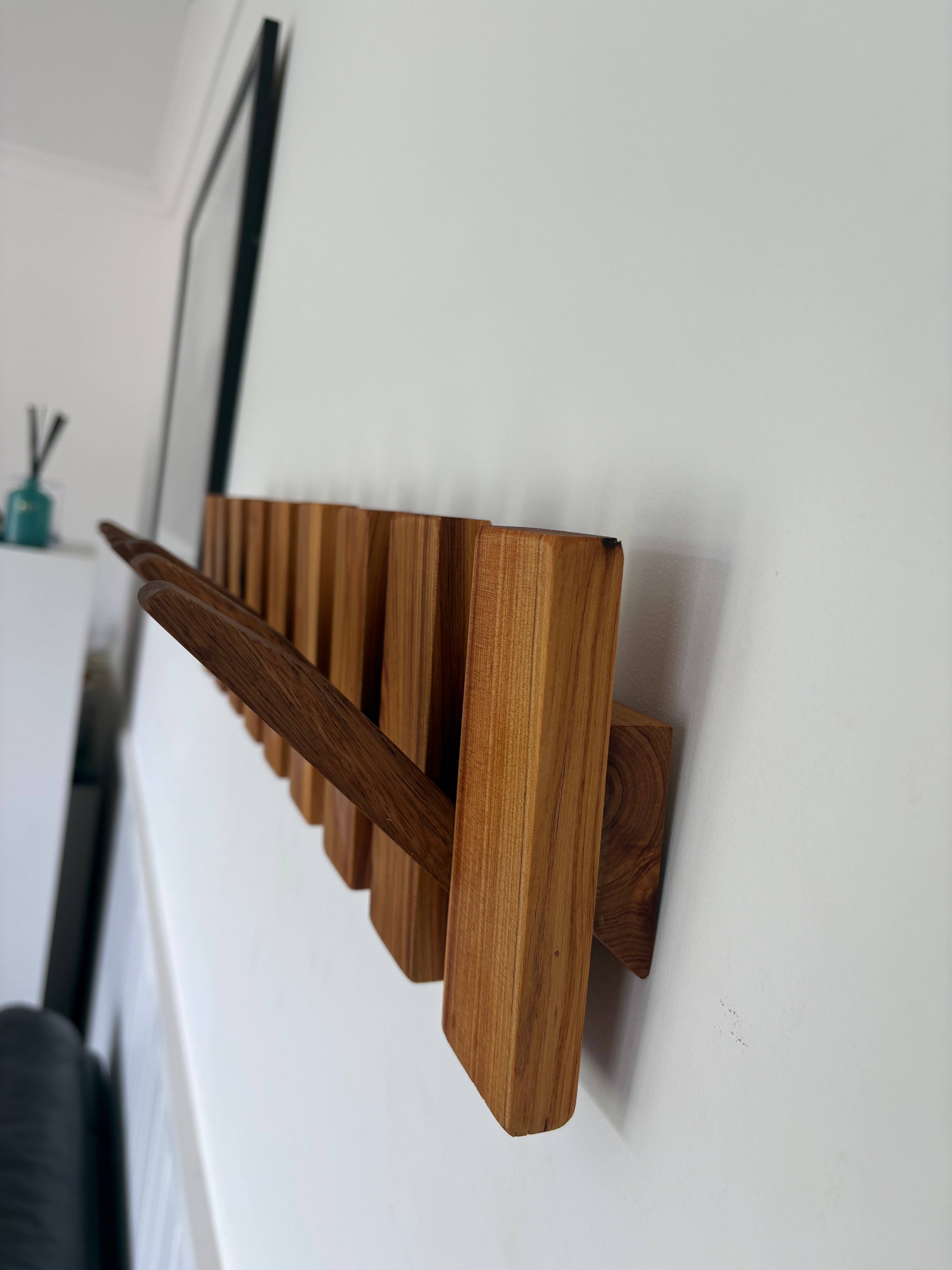 Two tone piano style coatrack