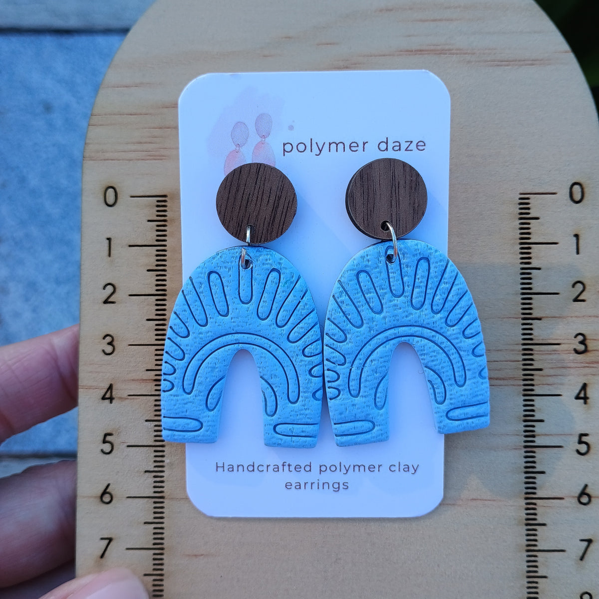 Embossed blue arch earrings with natural wood stud top