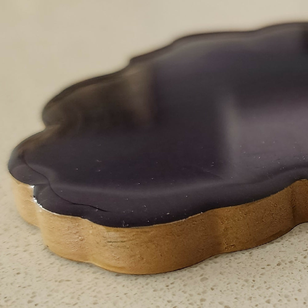 Purple and gold coaster closeup