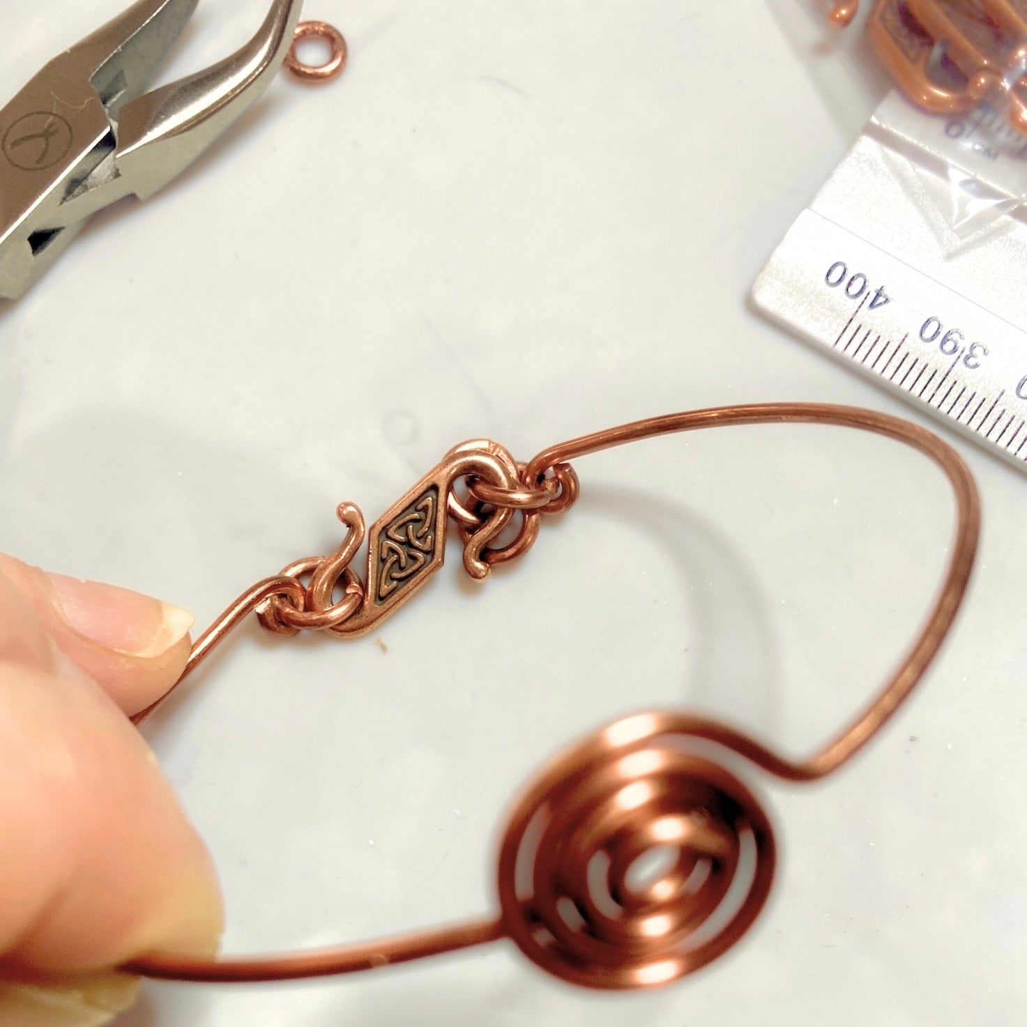 Simple antique copper spiral bracelet | Bangle with Triquetra clasp | Celtic-inspired jewellery