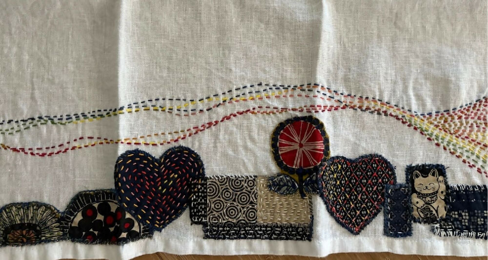 Detail from Lucky Cat handstitched linen teatowel by Leumesin Handmade