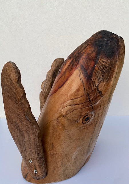 Hand carved breeching whale sculpture