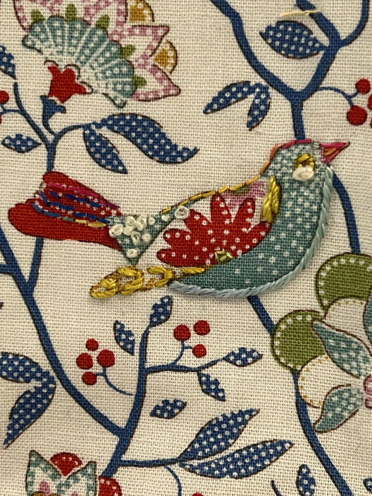 Padded pouch bag with lift up flap