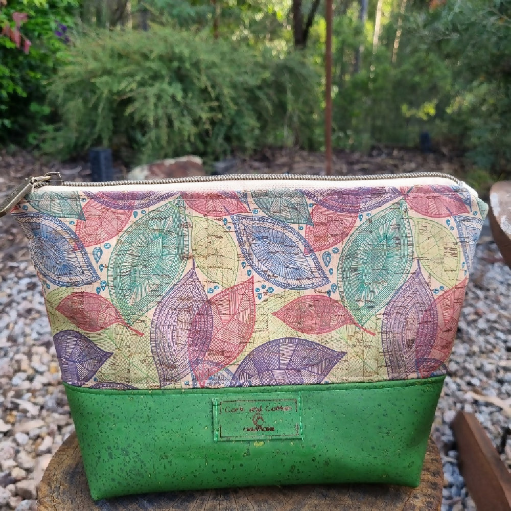 toiletry bag in leaf pattern and green cork.