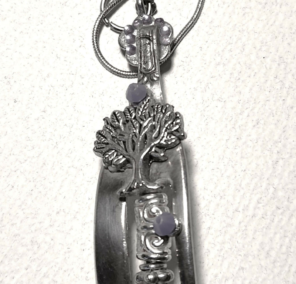 Recycled cutlery pendant with tree of life.