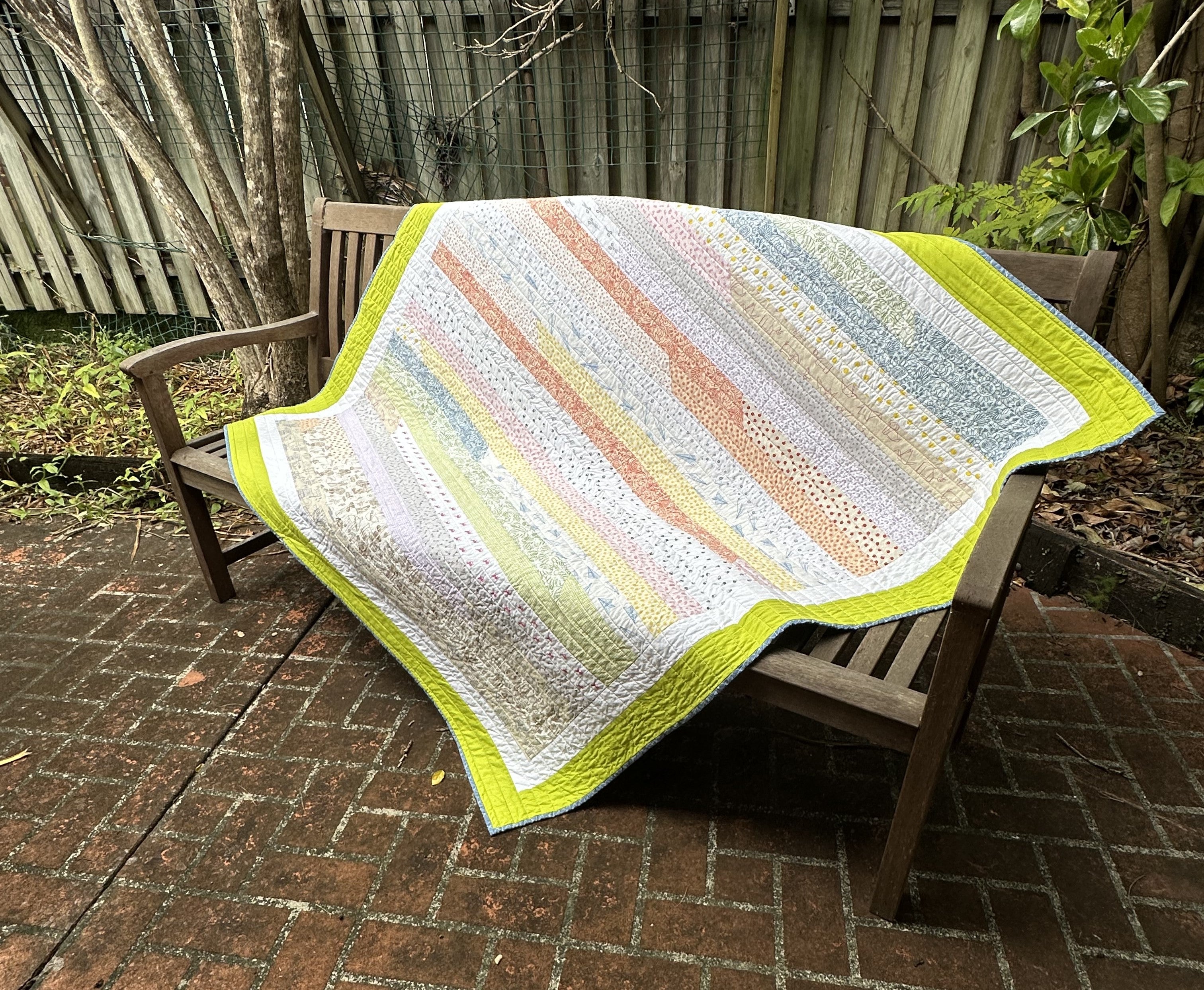 Striped Childrens' Quilt with Dinosaur Panel Backing