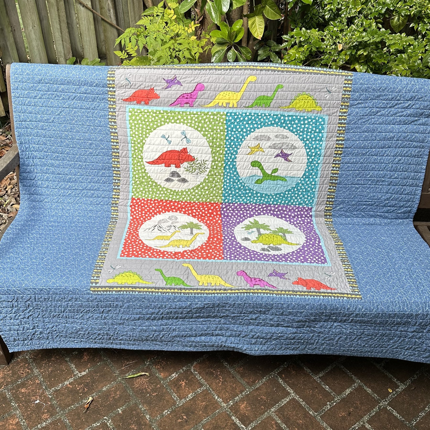 Striped Childrens' Quilt with Dinosaur Panel Backing