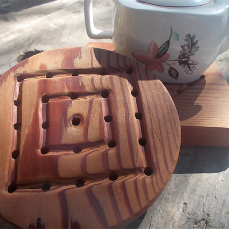 hand tooled round timber trivet