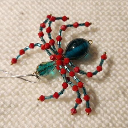 Pendant necklace crystal spider in blue and red