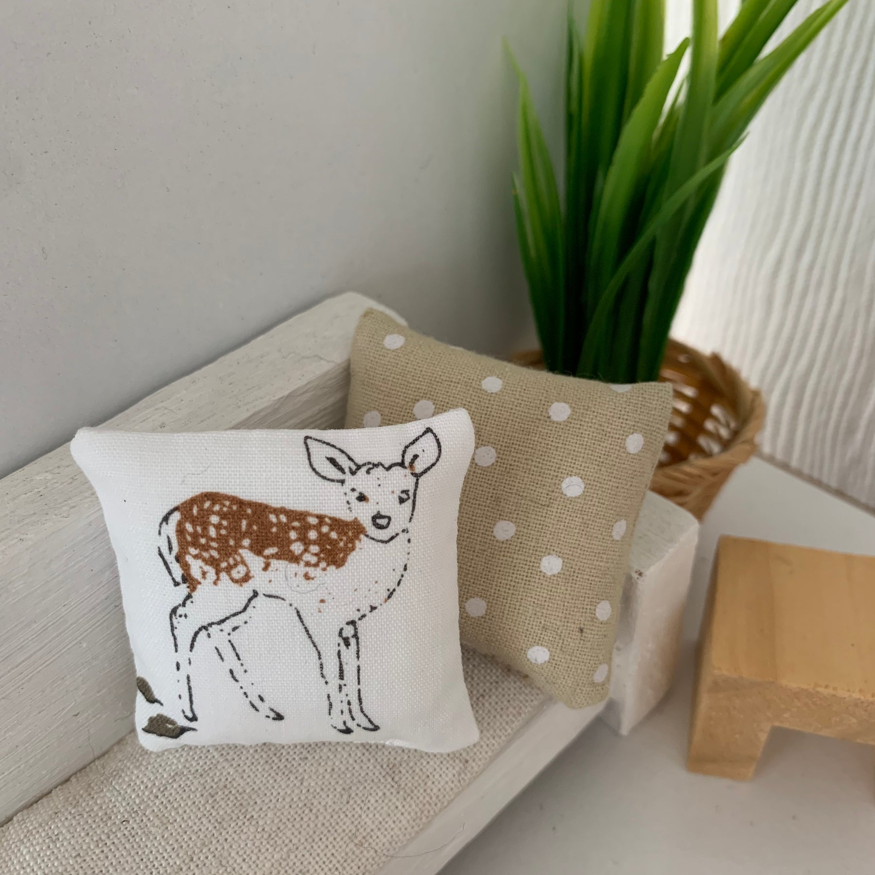 Miniature woodland throw pillows, dollhouse cushions.