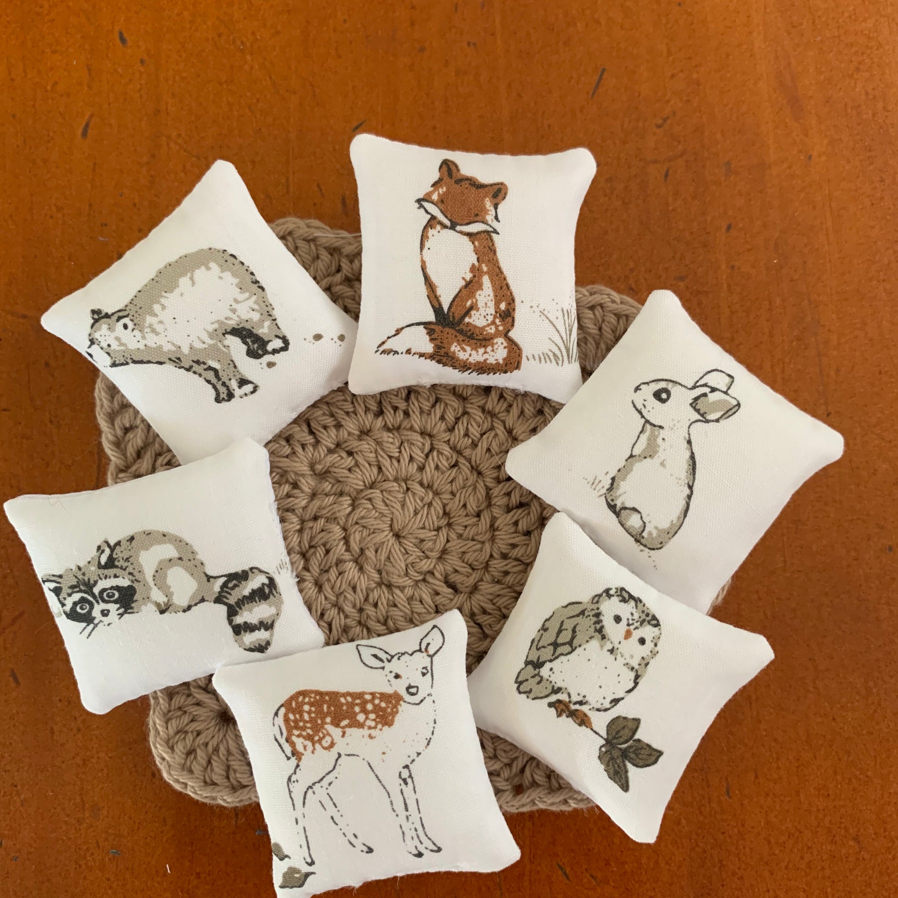 Miniature woodland throw pillows, dollhouse cushions.