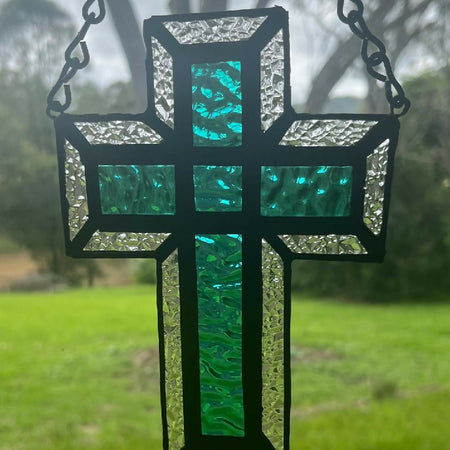 Teal blue stained glass cross