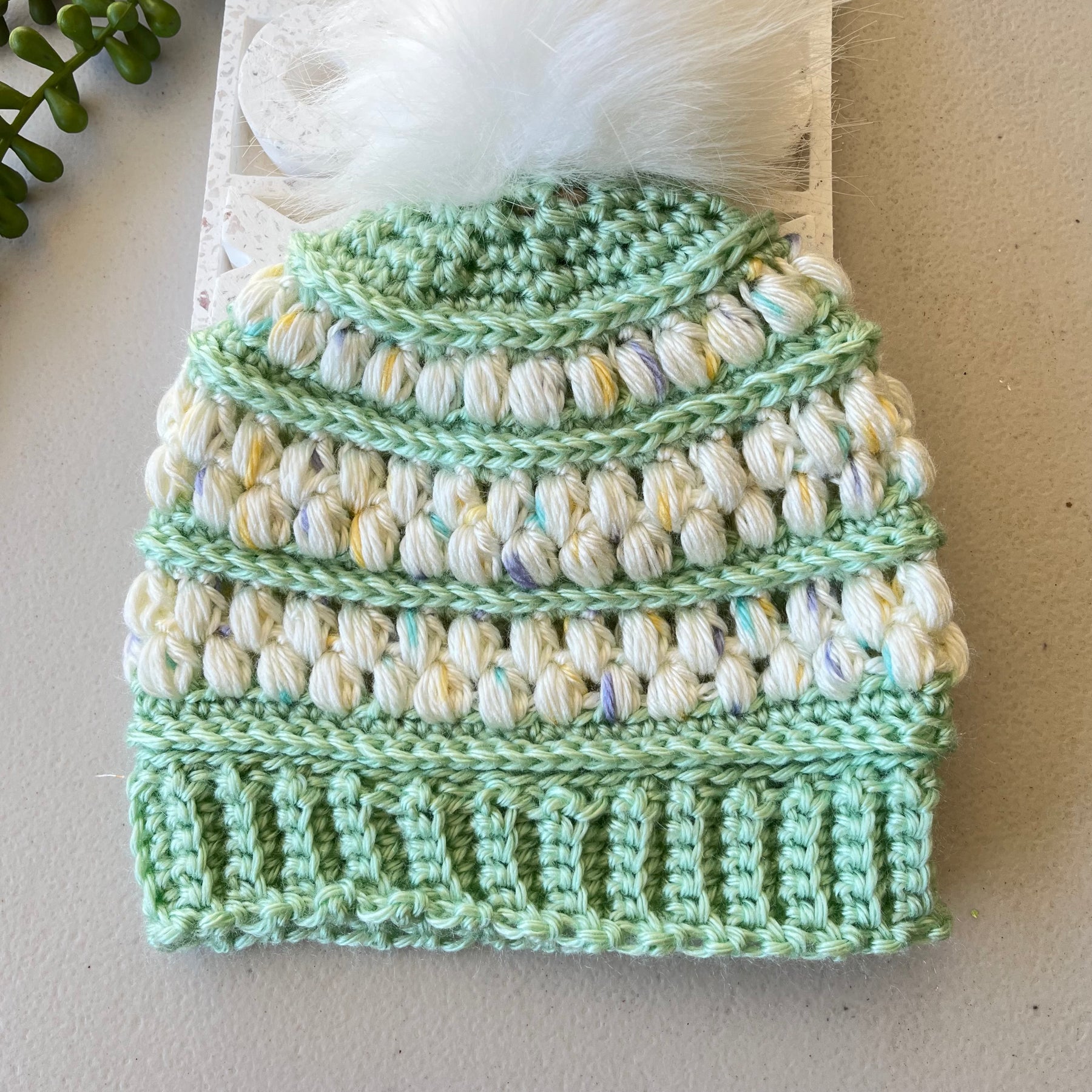 Children’s textured beanies with detachable pompom