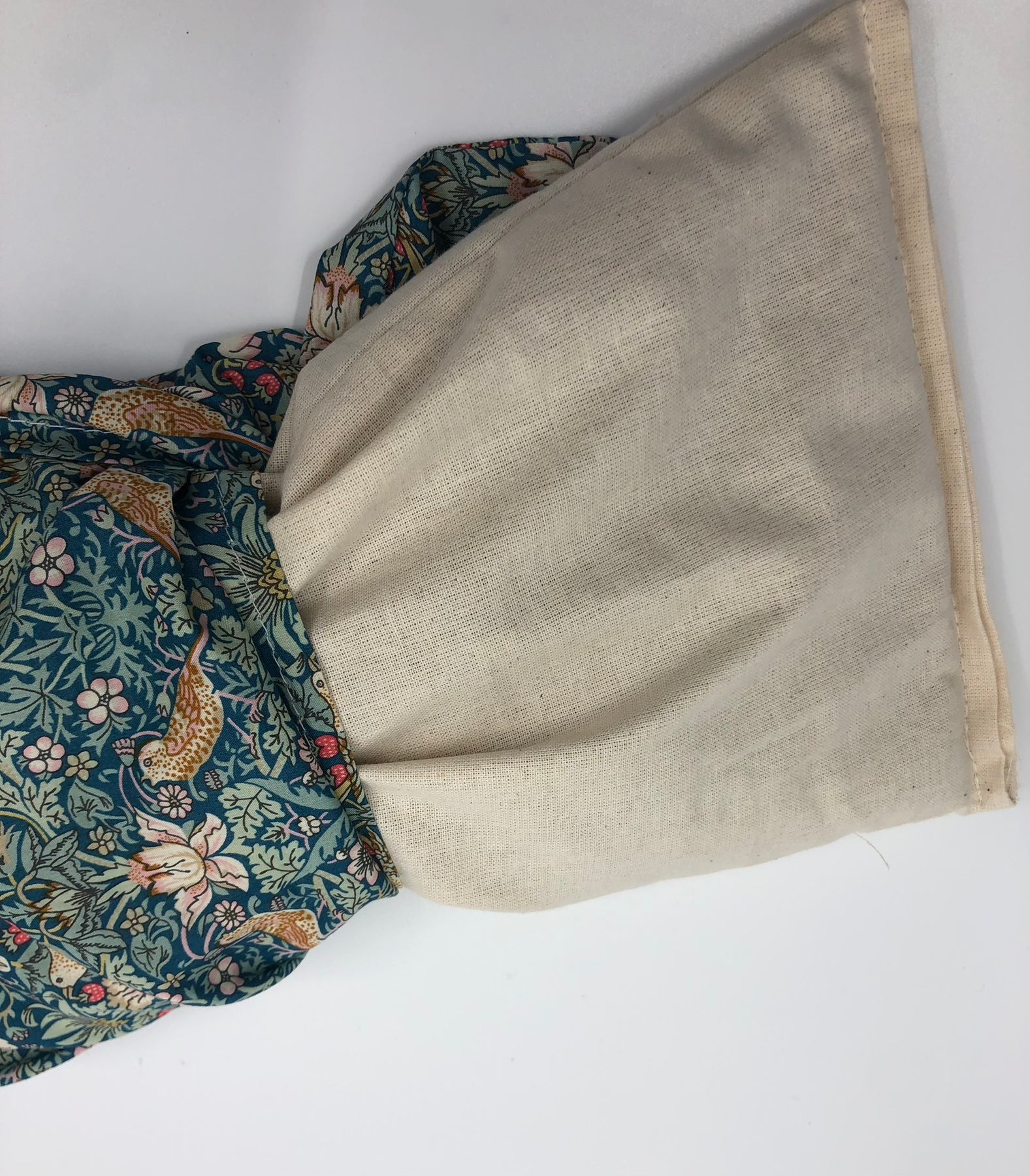 Wheat pack made with Liberty fabric outer layer and wheat in pouch inner layer