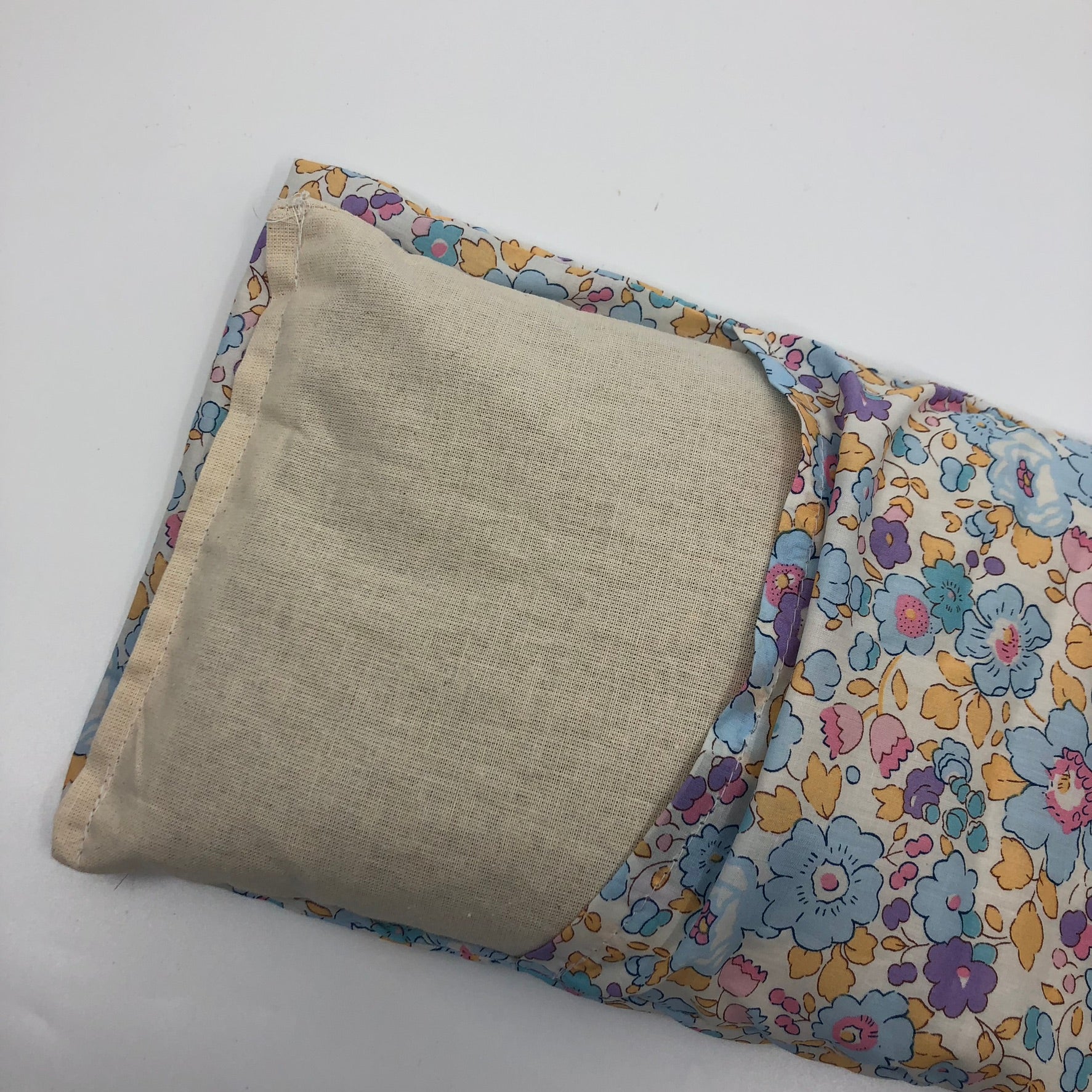 Wheat pack made with Liberty fabric outer layer and wheat in pouch inner layer