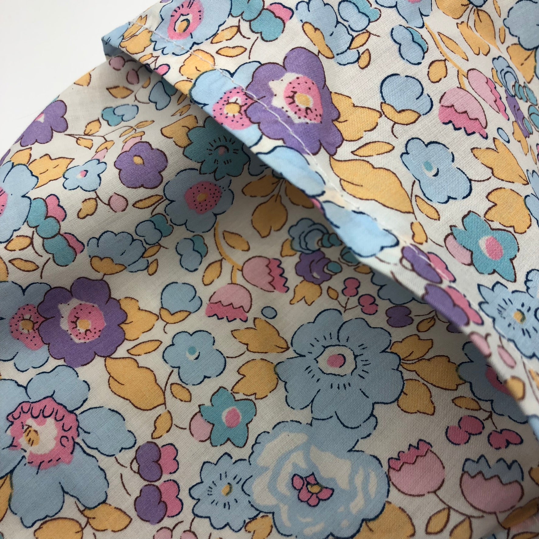 Wheat pack made with Liberty fabric outer layer and wheat in pouch inner layer
