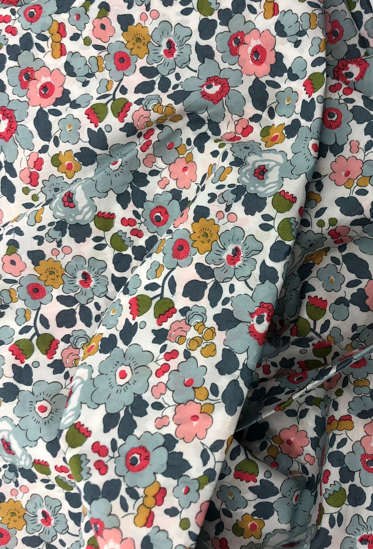 Wheat pack made with Liberty fabric outer layer and wheat in pouch inner layer