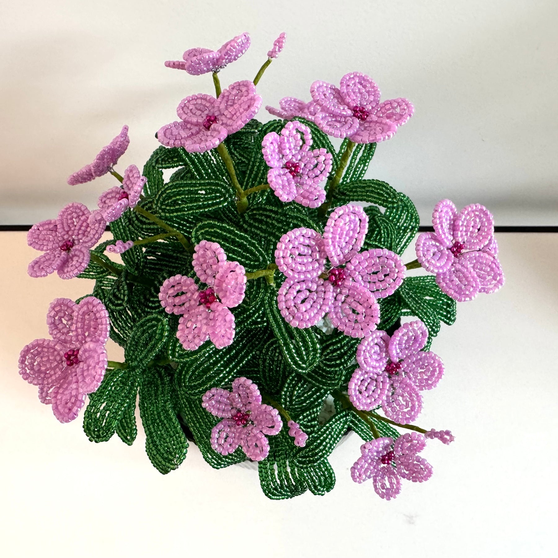 French-beaded potted pink Vinca flowers