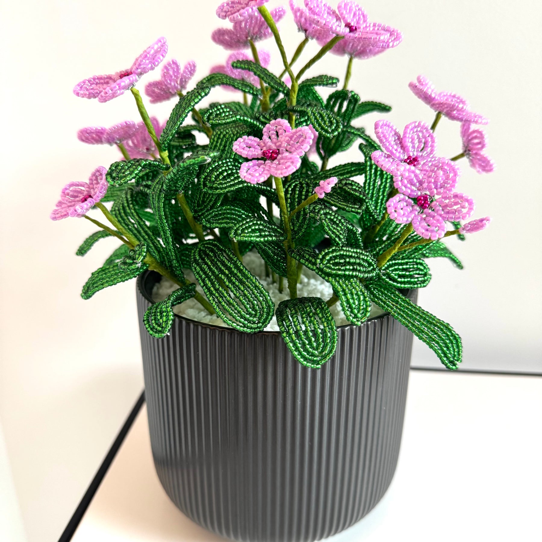 French-beaded potted pink Vinca flowers