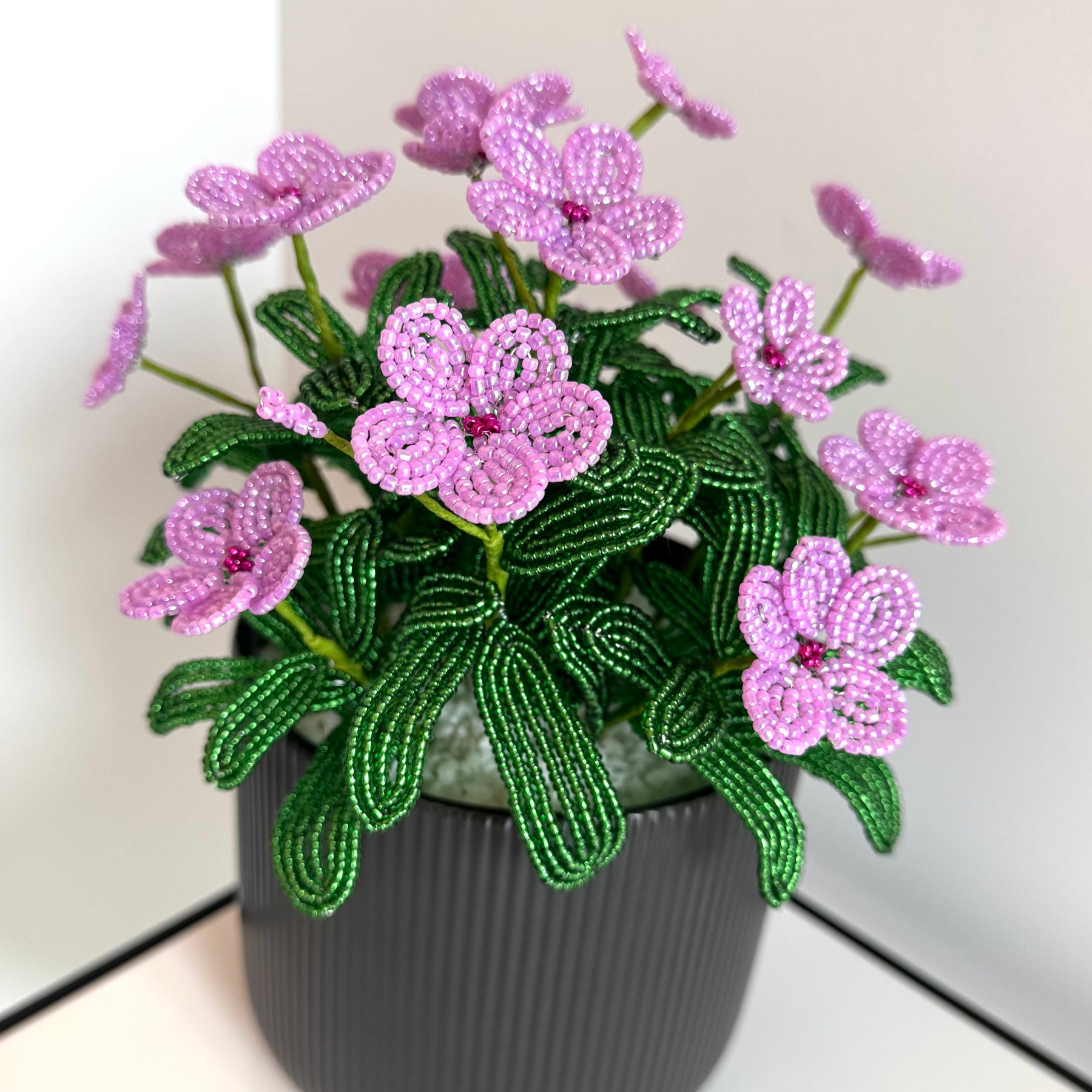 French-beaded potted pink Vinca flowers