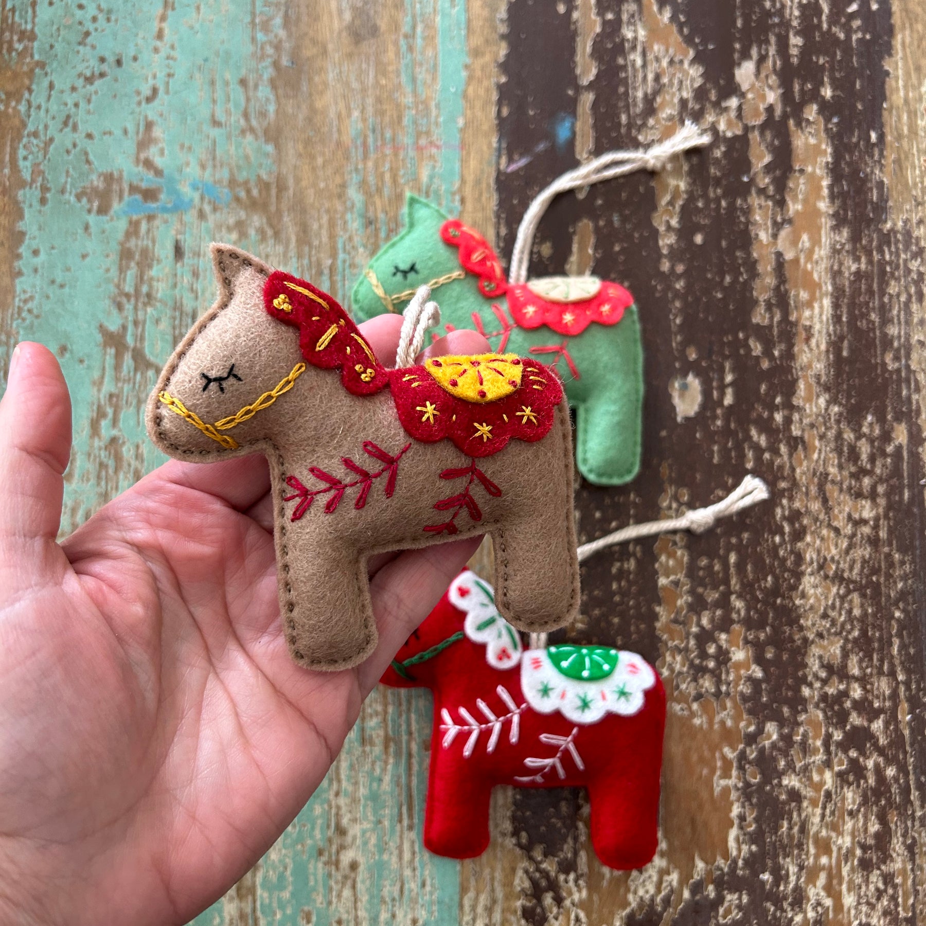 Scandinavian-inspired Dala horse ornament, hand embroidered for timeless holiday charm