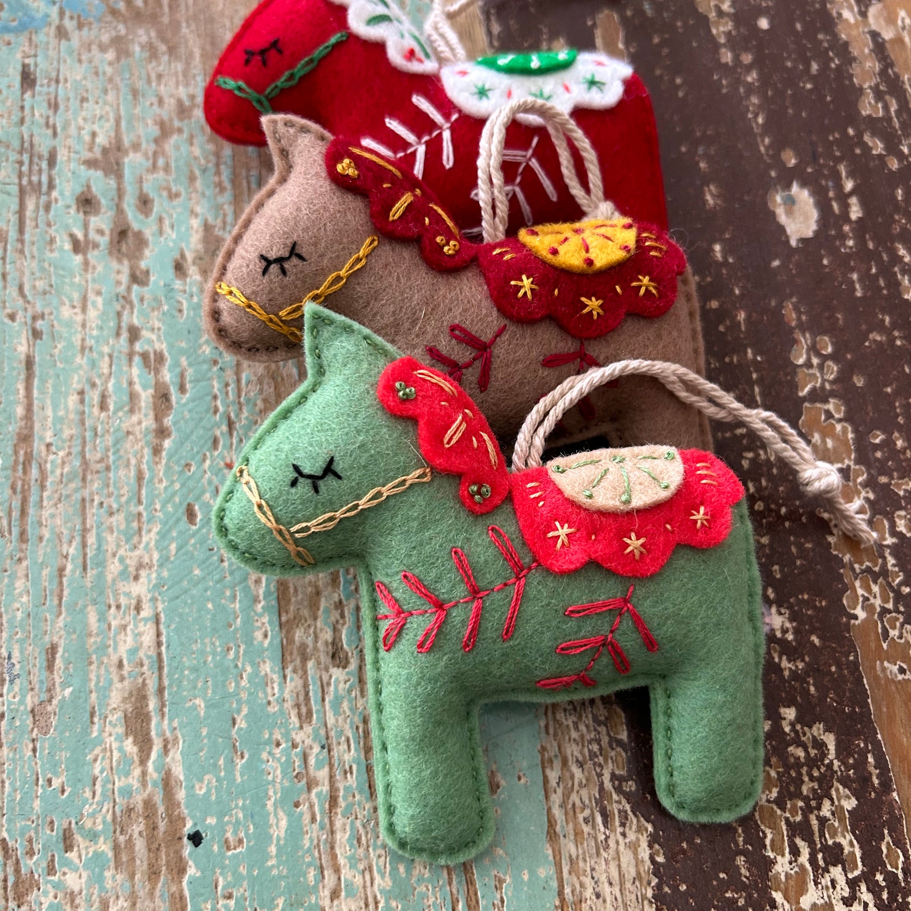 Scandinavian-inspired Dala horse ornament, hand embroidered for timeless holiday charm